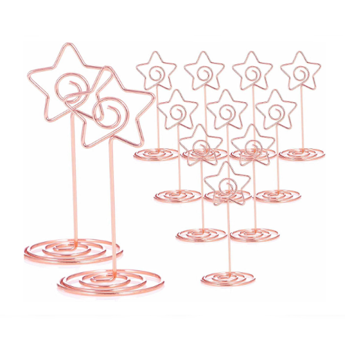 אביזרים לחתונה בזול חבילה של 12 מחזיקים למספרי שולחנות או כרטיסי הושבה בעיצוב כוכב קסום ובצבע רוז גולד האהוב